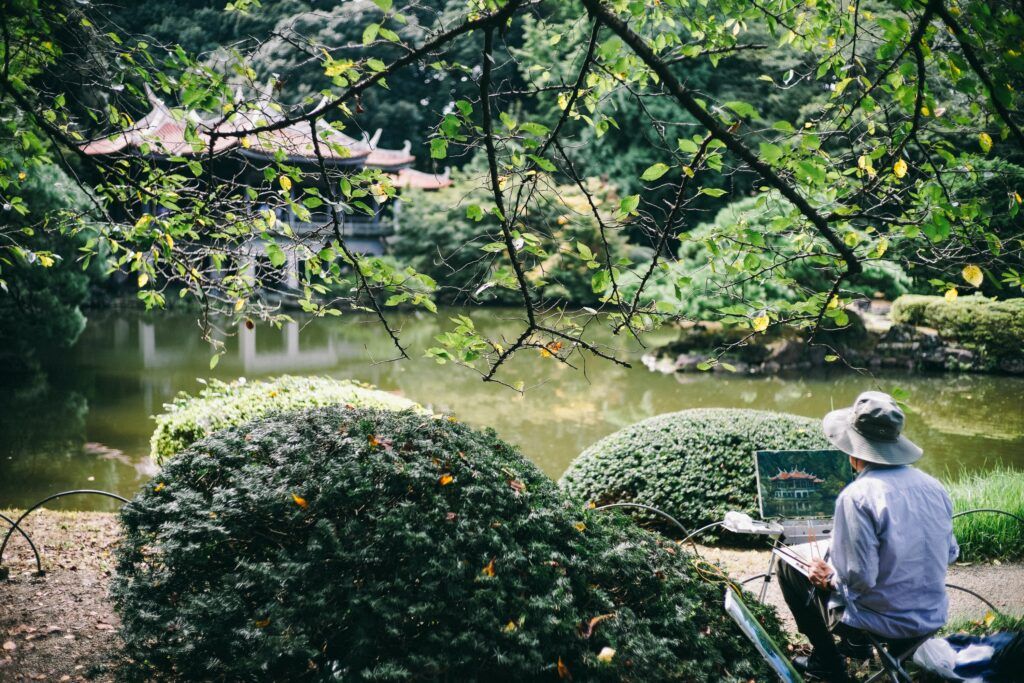 How To Create A Zen Garden - Man Painting In Zen Garden